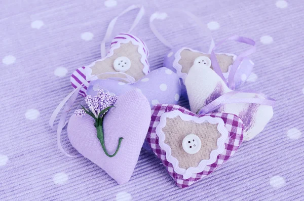 Decorative lavender hearts on lavender background — Stock Photo, Image