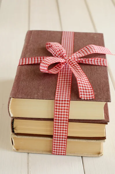 Books bounded up in red ribbon — Stock Photo, Image