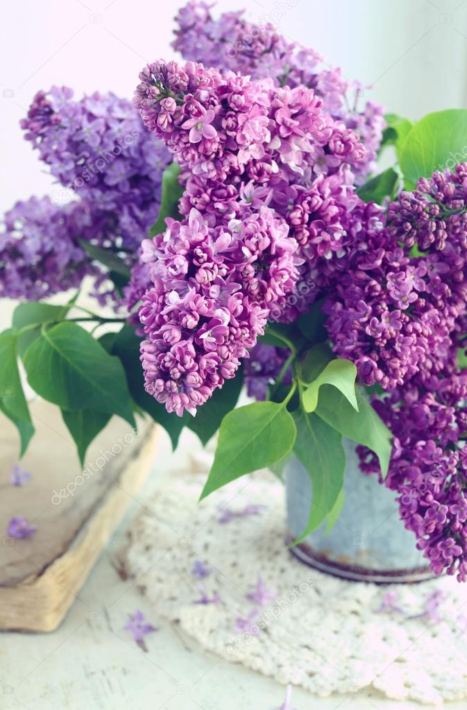 Beautiful lilac flowers in grey vase