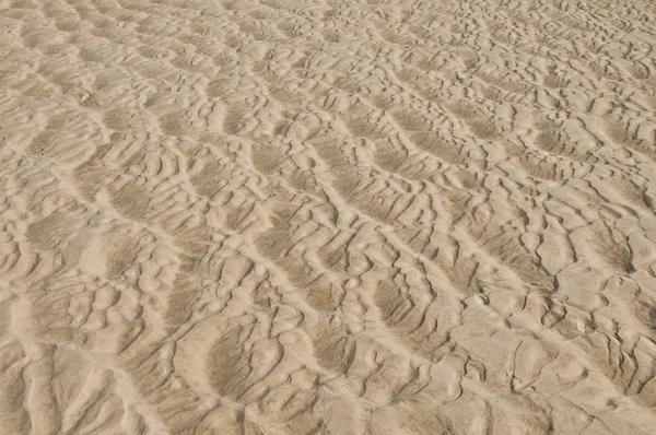 Textura na areia criou água — Fotografia de Stock