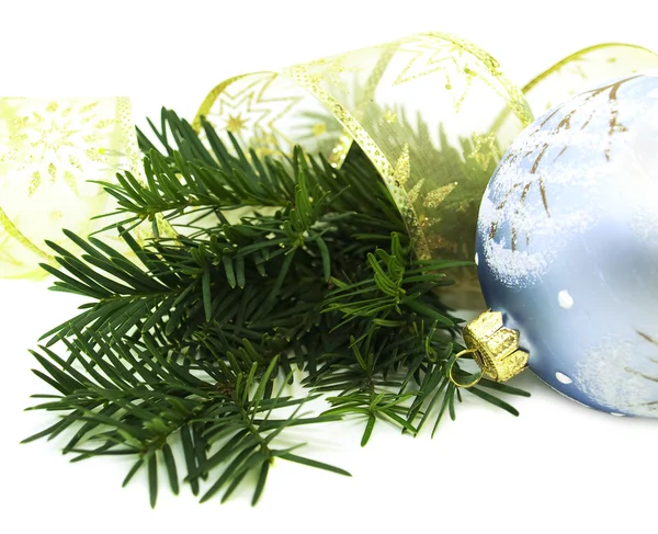 Christmas pine, ribbon and bauble — Stock Photo, Image