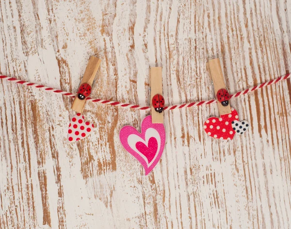 Hearts hanging on a rope with pins — Stock Photo, Image