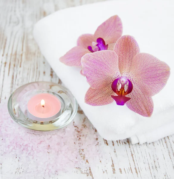 Orchids and candle — Stock Photo, Image