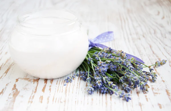 Container with cream and lavender — Stock Photo, Image