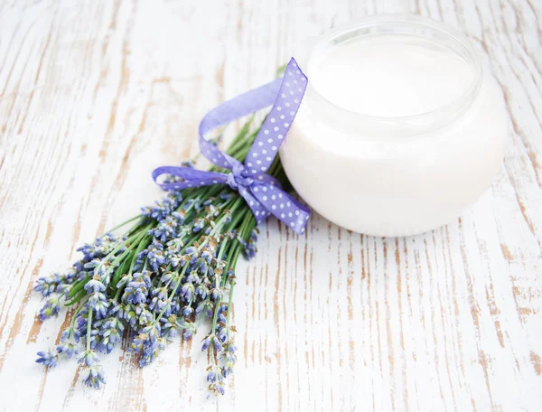 Container with cream and lavender — Stock Photo, Image
