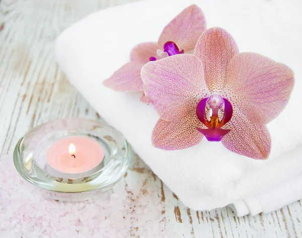 Orchids and candle — Stock Photo, Image