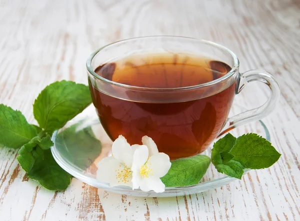 Tea and jasmine flowers and mint — Stock Photo, Image