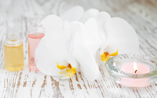 Orchids and candle — Stock Photo, Image