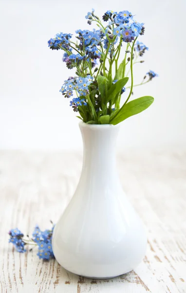 Forget-me-nots on wooden table — Stock Photo, Image