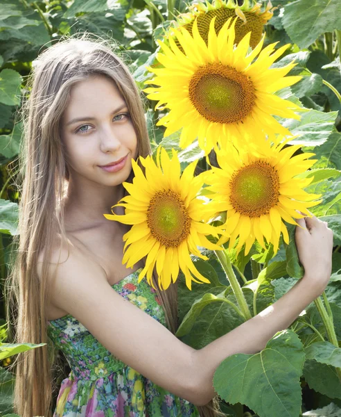 Beautiful girl with sunflower — Stock Photo, Image