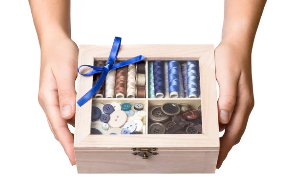 Hands showing sewing box — Stock Photo, Image