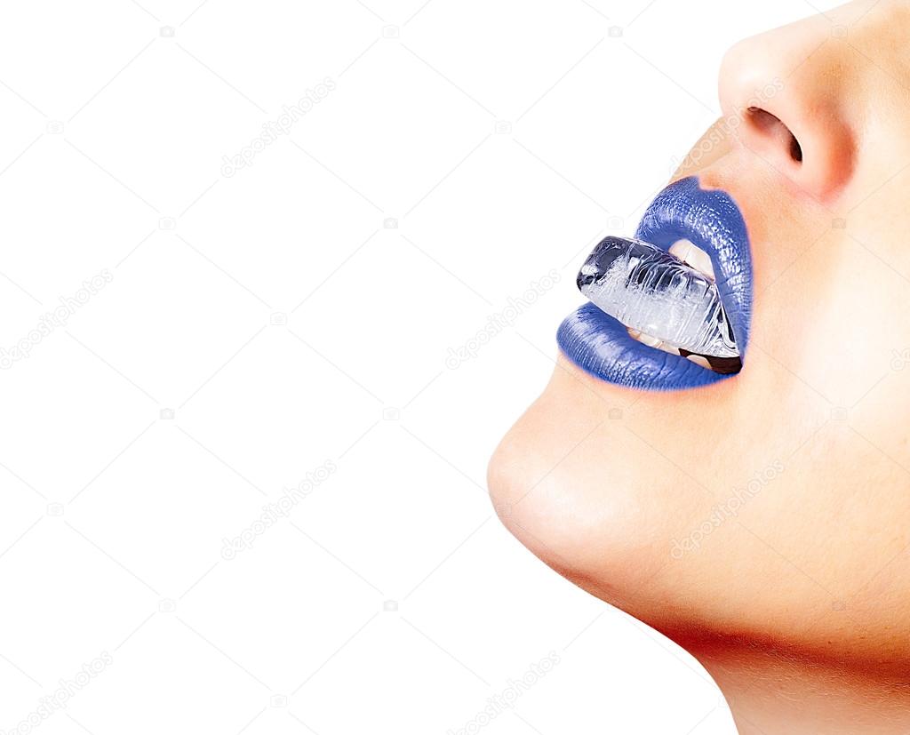 Closeup of blue lips whit an ice cube