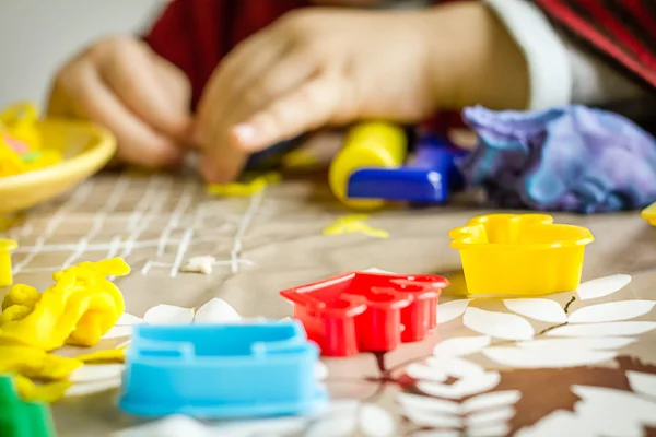 Closeup of plasticine molds and child hands on the background — Stock Photo, Image