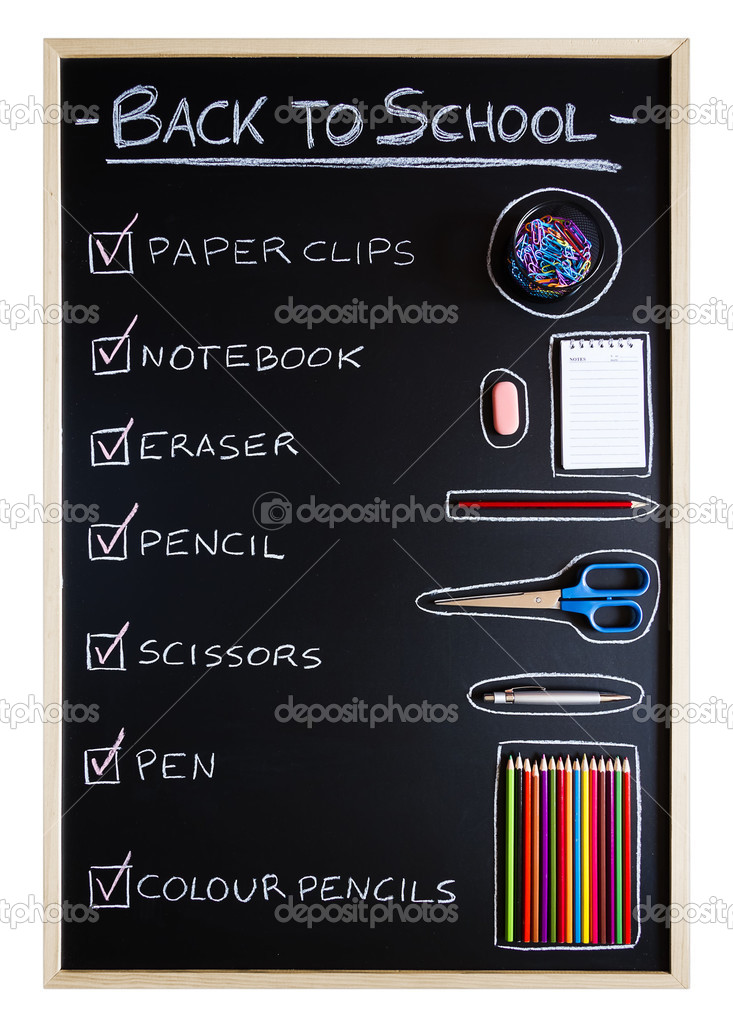 School supplies over blackboard background