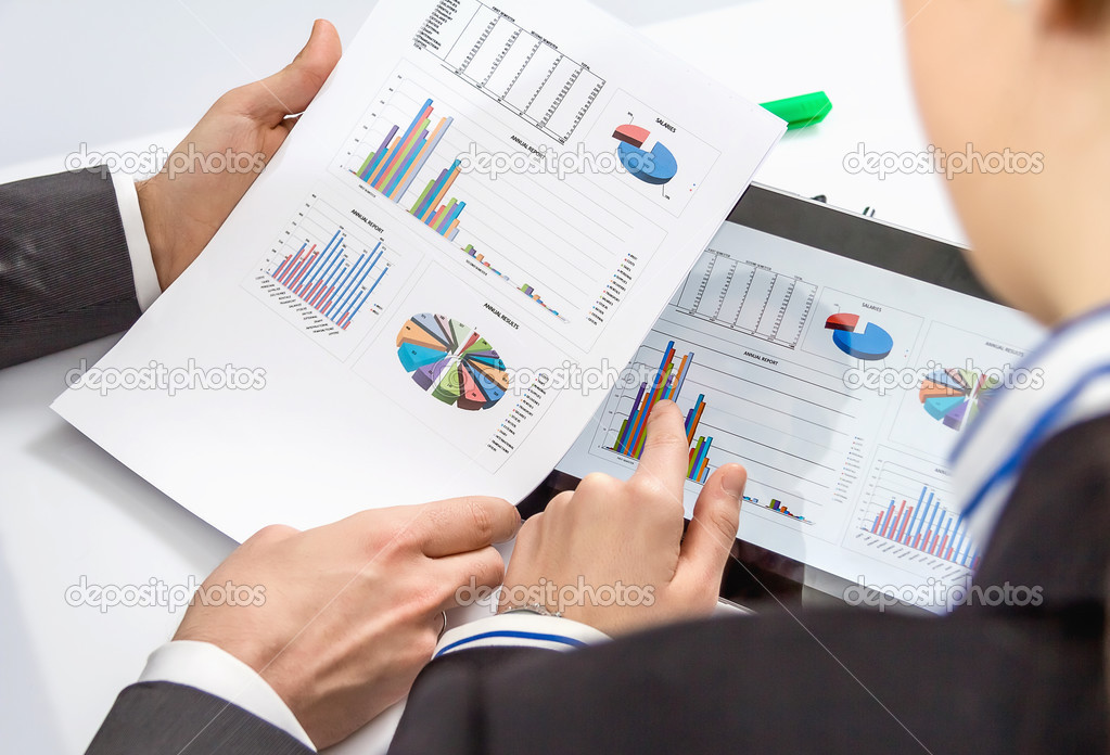 Businesswoman showing documents in digital tablet