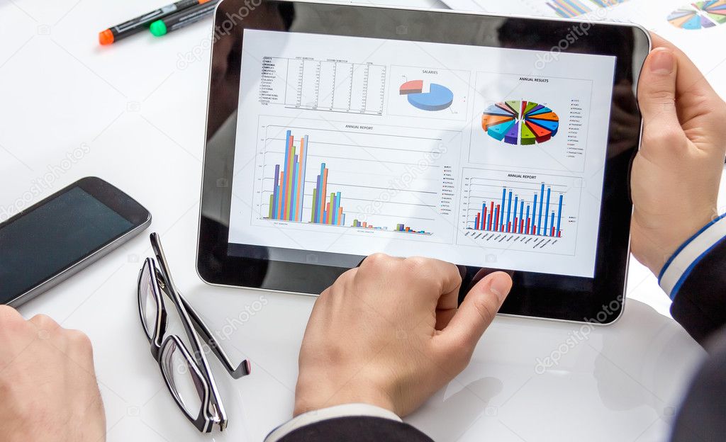 Business people analyzing documents in a meeting