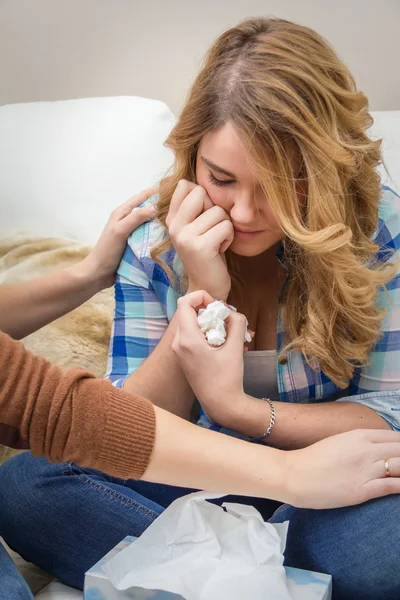 Hands of mother consoling sad teen daughter crying — Stock Photo, Image