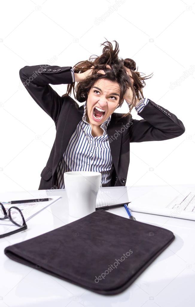 Stressed business woman screaming and pulling hair