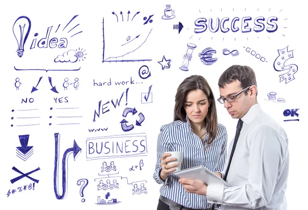 Business people with tablet over success symbols — Stock Photo, Image