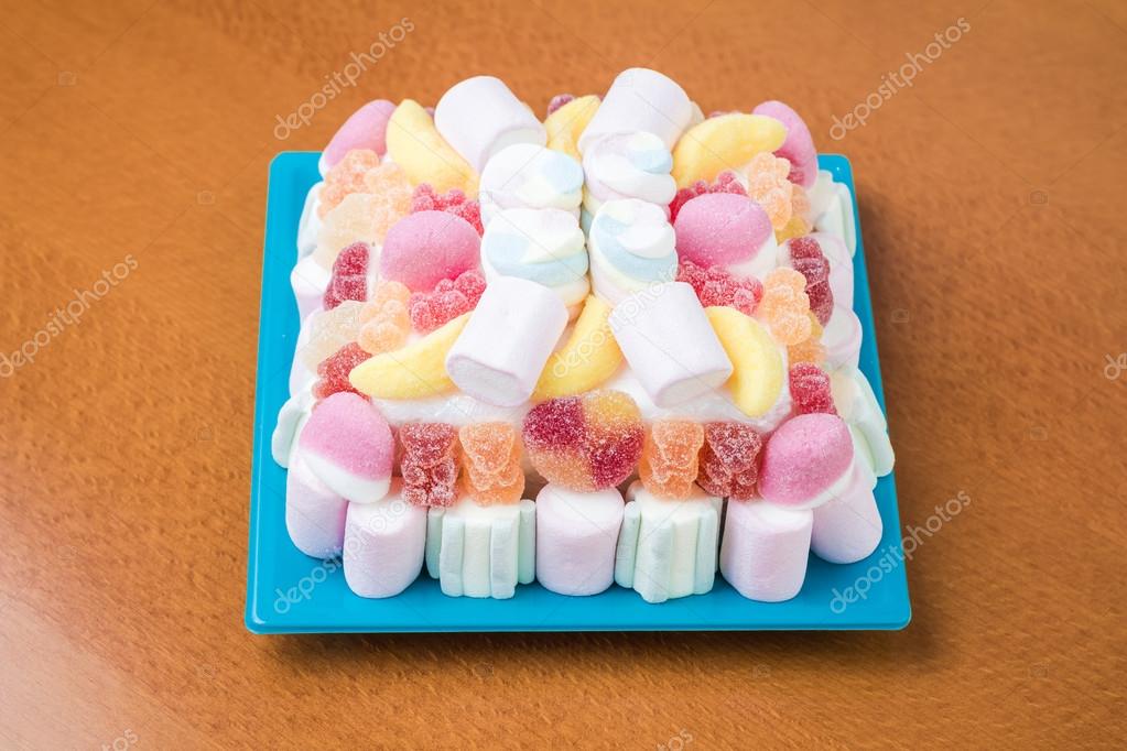 Marshmallows and jelly beans cake in pastel tones — Stock Photo © doble