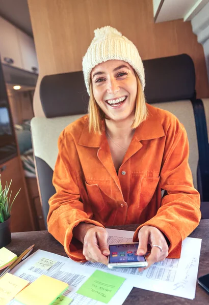 Woman laughing in work meeting by video call from her camper van — Foto de Stock