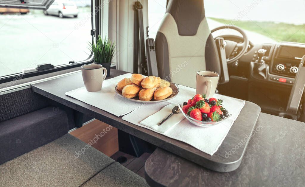 Breakfast on the table in a camper van