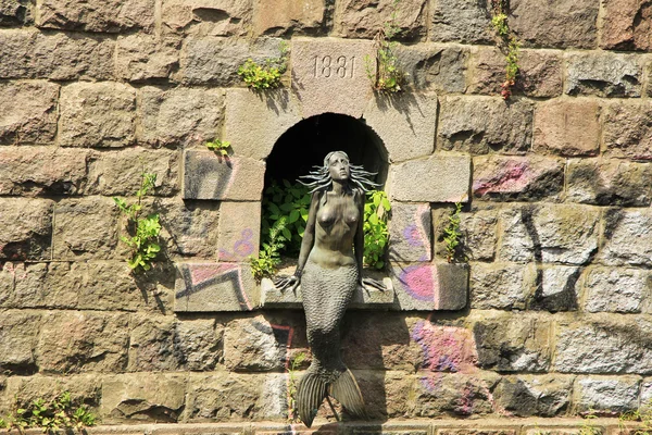Metal mermaid statue in Vilnius, Lithuania
