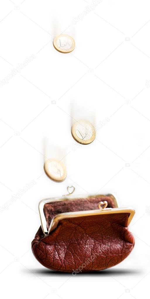 Coins falling in purse