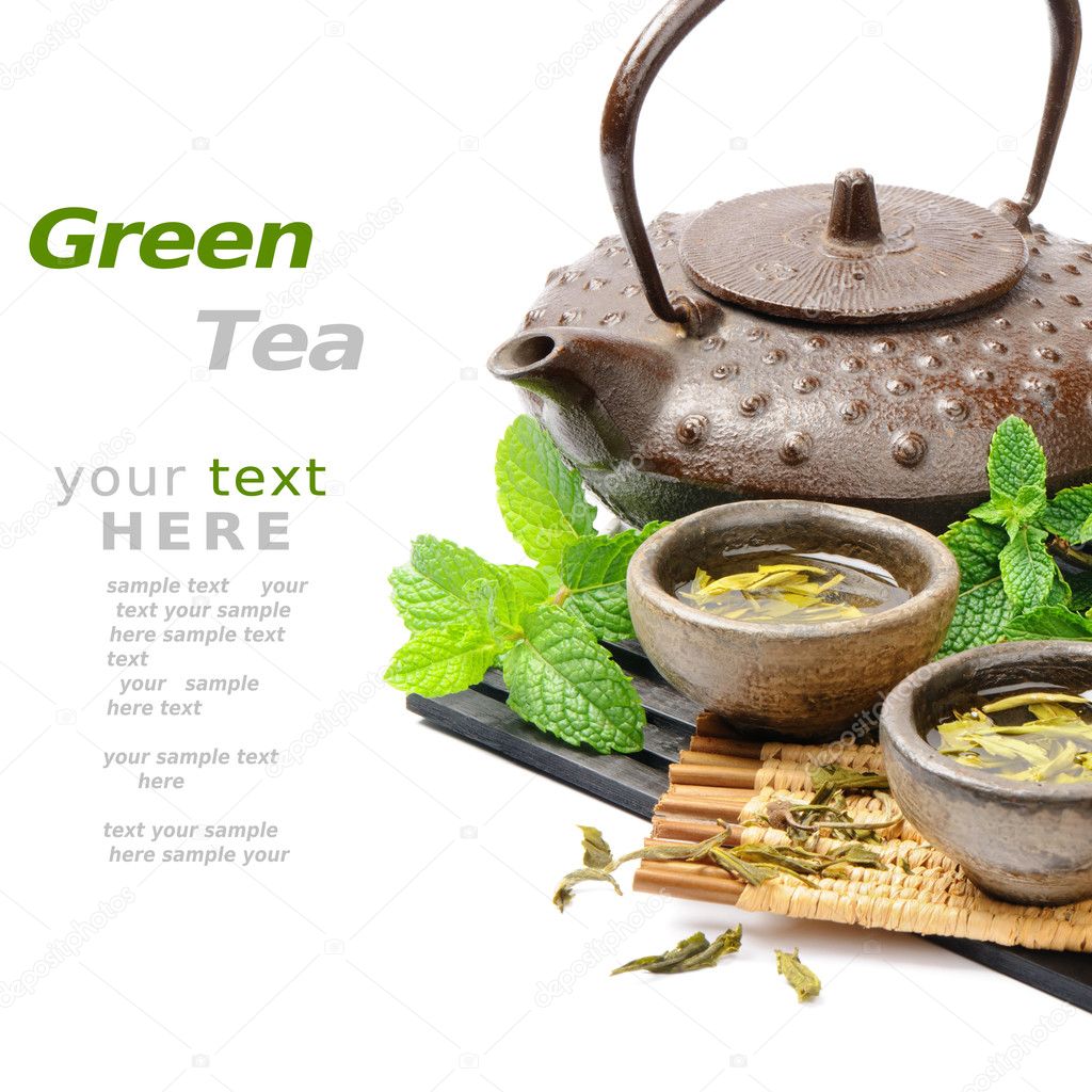 Asian tea set with dried green tea and fresh mint