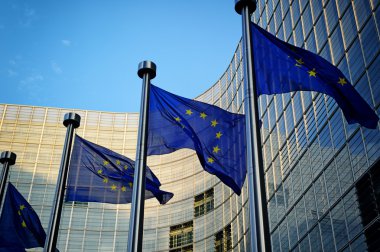 EU flags in front of European Commission clipart