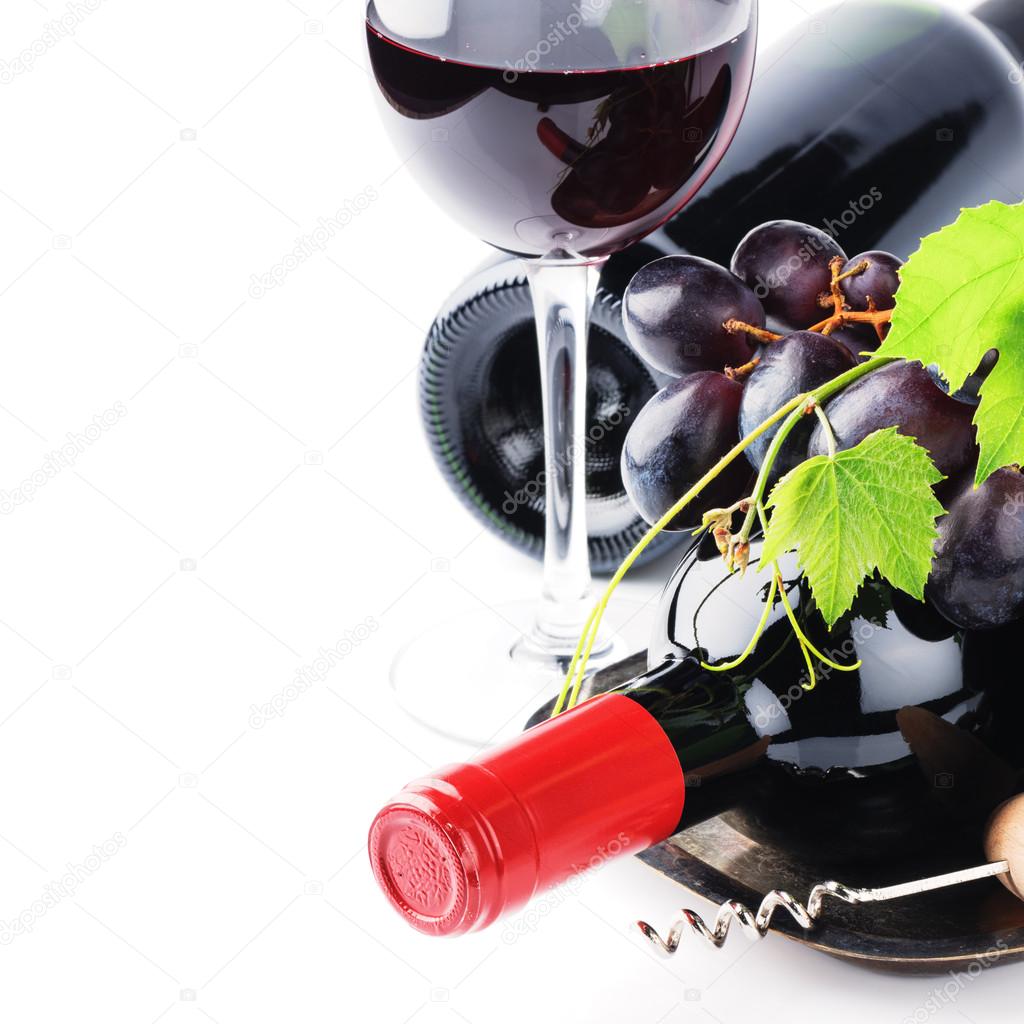 Bottles of red wine with fresh grape