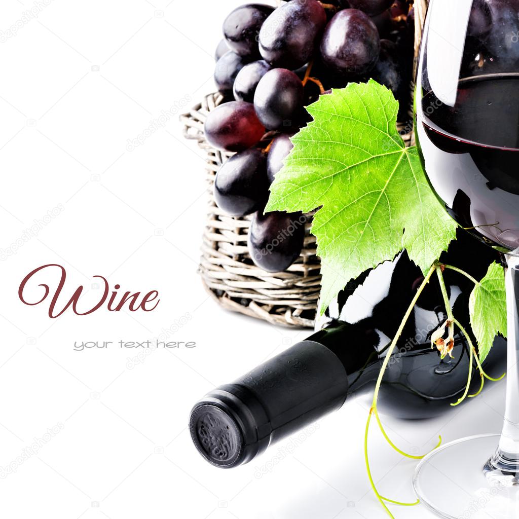 Bottle of red wine with fresh grape
