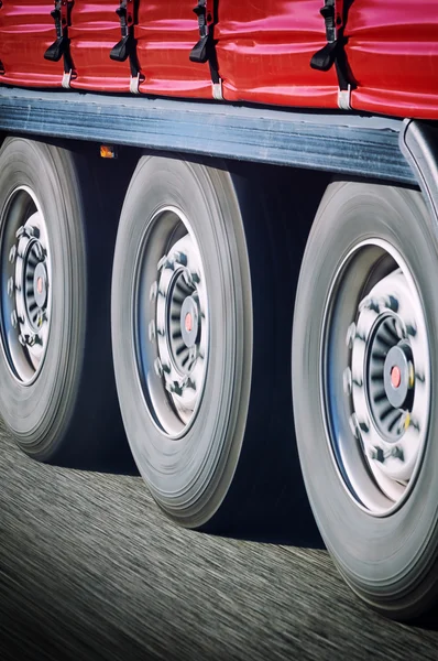 Truck wheels in motion — Stock Photo, Image