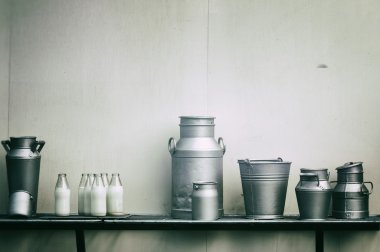 Old milk jugs, cans and bottles clipart