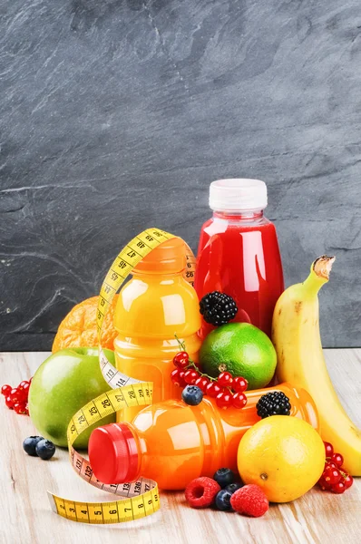 Fruits and various juices — Stock Photo, Image