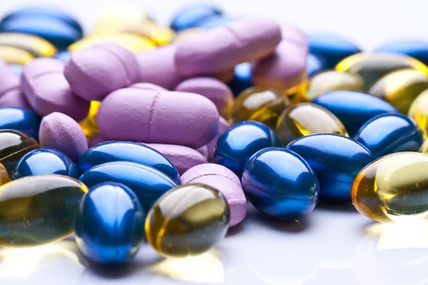 Colorful vitamin gel capsules isolated on whiteback ground — Stock Photo, Image