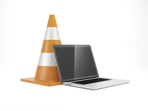 Under construction. Traffic cone and laptop — Stok fotoğraf