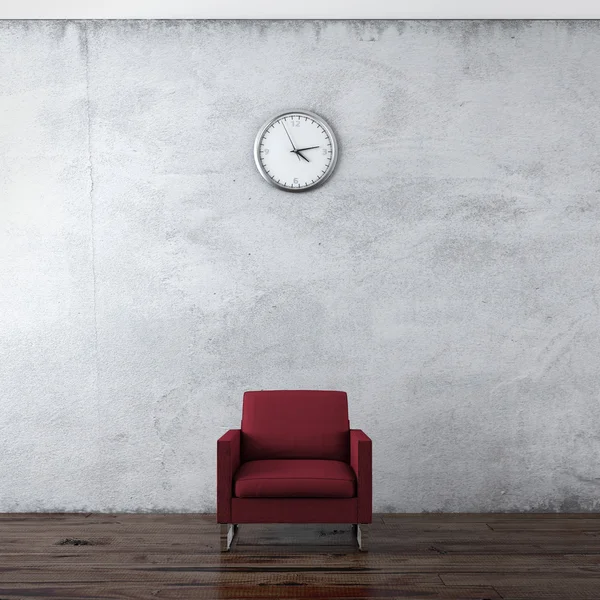 Um relógio de parede e cadeira vermelha — Fotografia de Stock