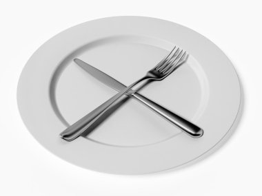 bıçak ve çatal beyaz plaka üzerinde