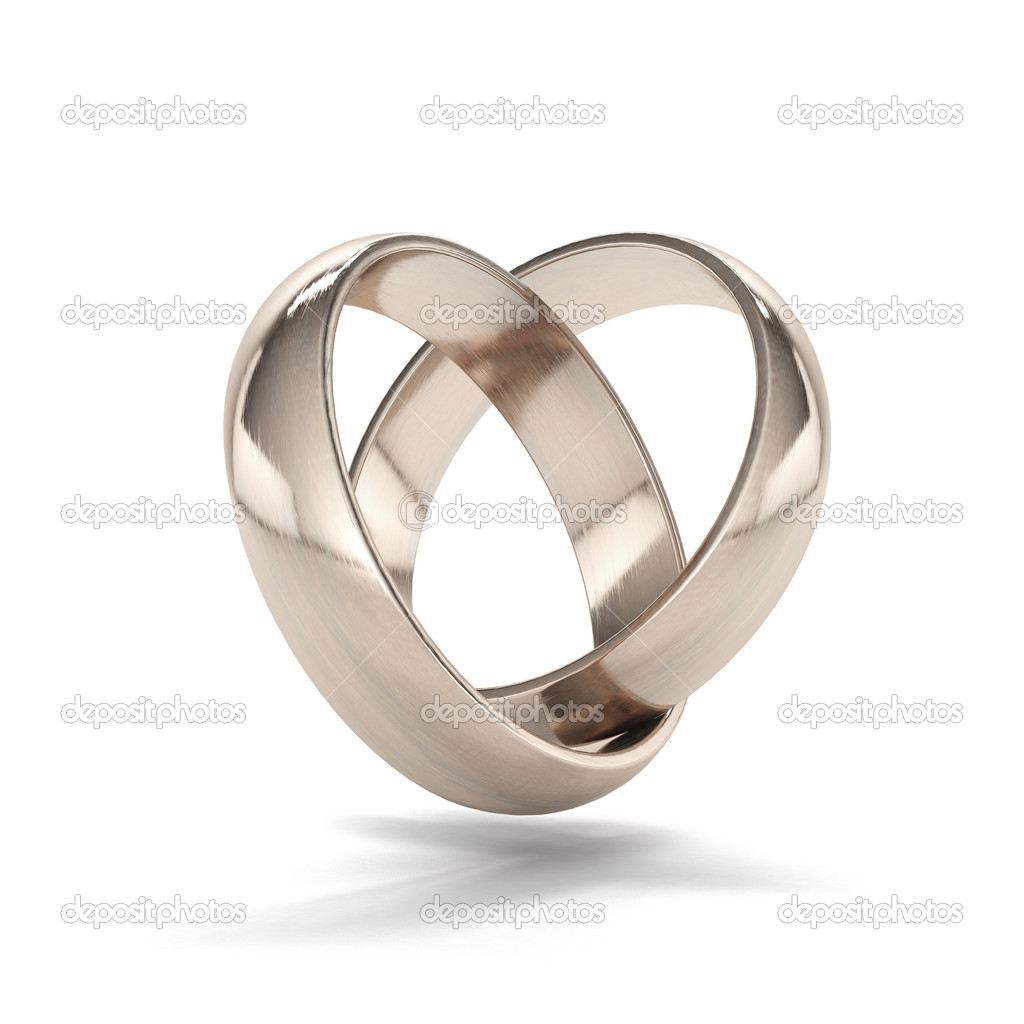 Couple of gold wedding rings in heart shape
