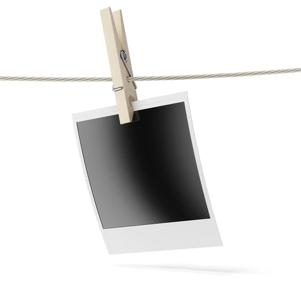 Blank instant photo hanging on the clothesline — Stock Photo, Image