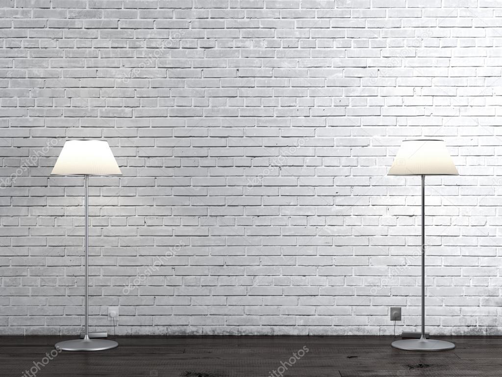 Two floor lamps in brick room