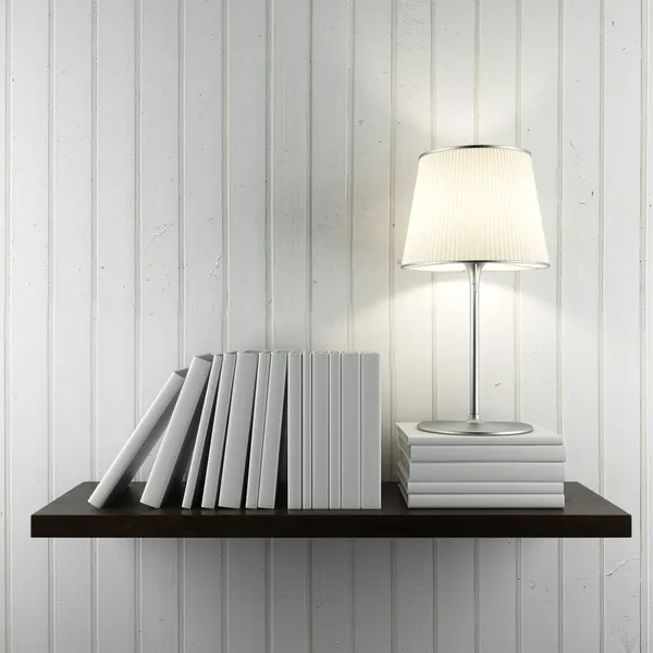 Plank met boeken en lamp — Stockfoto