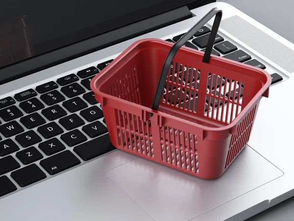 Food basket and laptop — Stock Photo, Image