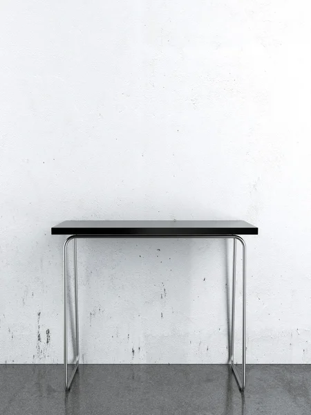 Tavolo nero davanti a una parete bianca — Foto Stock