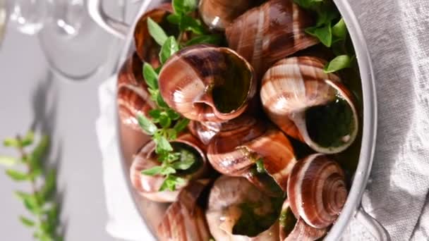 Grilled snails , cooking barbecue seafood with pesto sauce. French cuisine. Vertical video, ideal for social media and smartphones — Video Stock