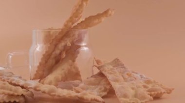 CHIACCHIERE. homemade traditional carnival sweets. Traditional sweet crisp pastry deep-fried and sprinkled with powdered sugar. Italian carnival food tradition