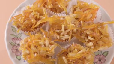 A typical Italian dessert from the Sardinia, Nuorese, Baronia and Gallura regions. thin strips of candied orange peel with honey, from almonds, from typical products of the region. FullHD footage