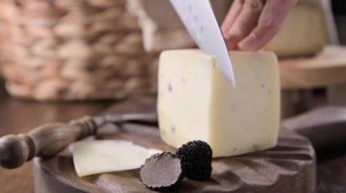 Pecorino cheese with truffle, traditional Italian sheeps milk cheese with truffle. A typical product of the dairy regions of Tuscany and Sardinia. High quality 4k footage