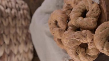 Taralli, a popular cheap snack, for sale in Naples, Italy. Neapolitan cookies called made with lard almond or black pepper. High quality 4k footage. Vertical view, for social networks and advertising